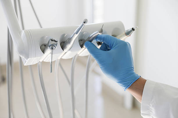 Professional Tooth Extraction technician working in Medford, NY